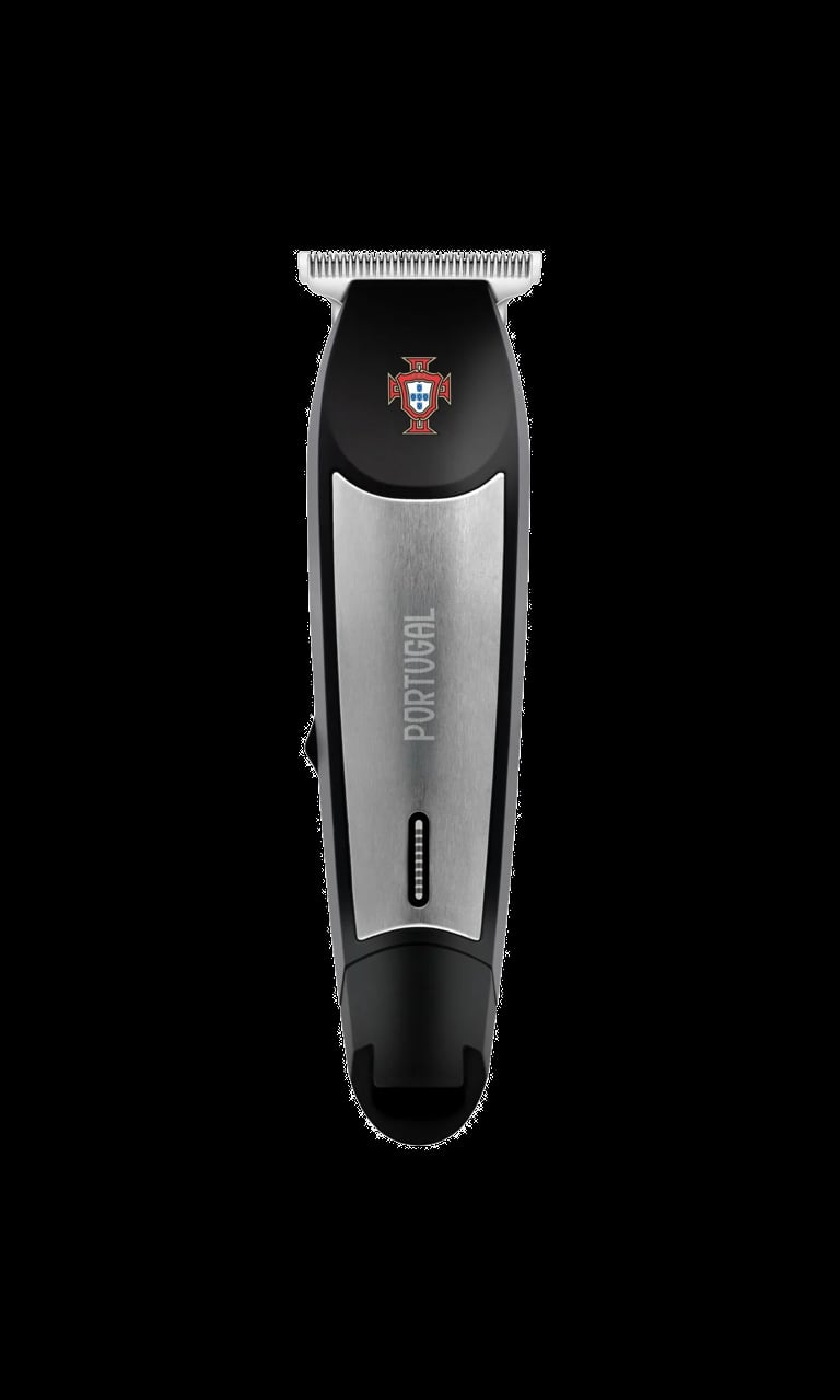 Portugal electric hair clipper with white comb guard, black and silver body on black background